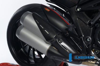 Exhaust heat shield on silencer carbon